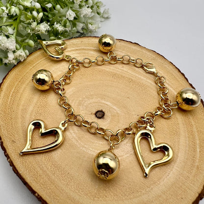 Pulseira Bolas e Corações Vazados