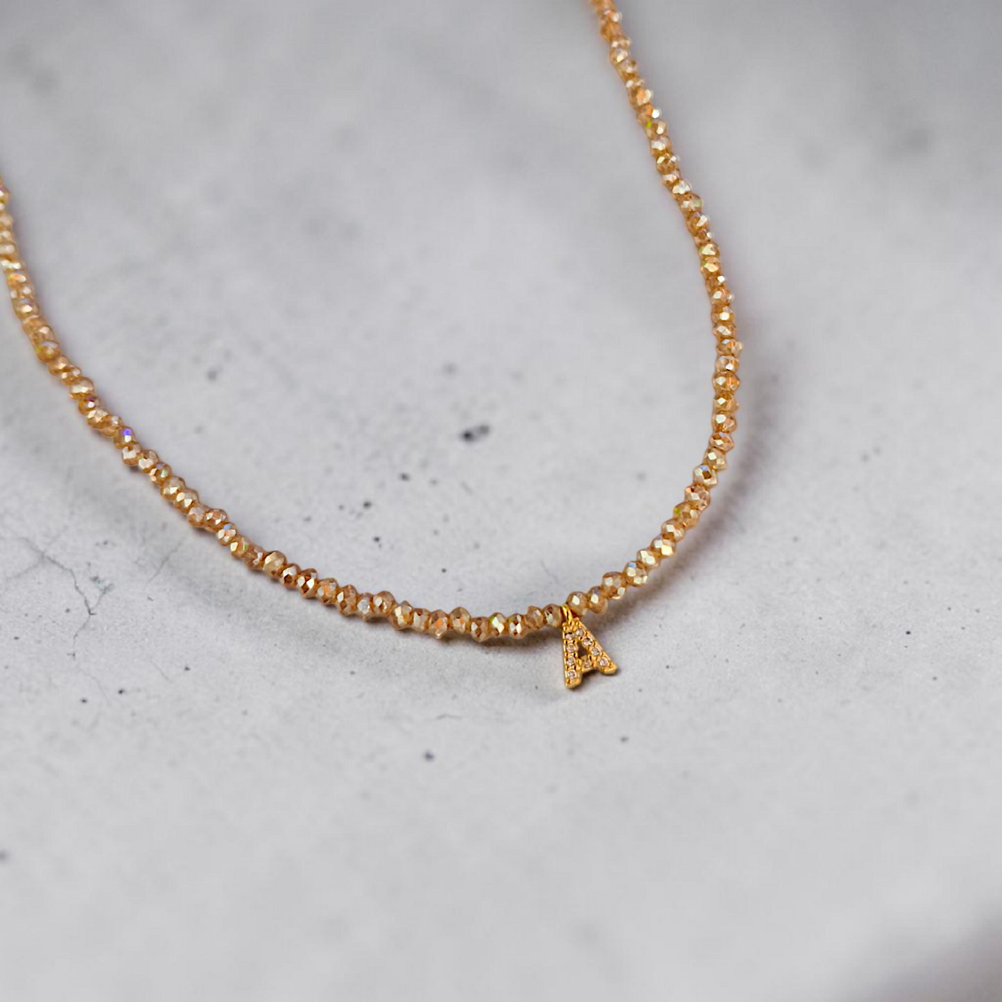 Colar Cristais e Inicial Microzircônias